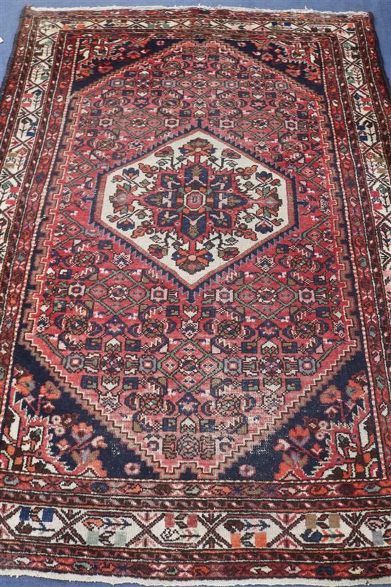 A Persian red ground rug, 195 x 145cm